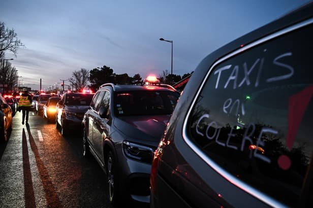 Taxi drivers block French roads and airport access in protest over fares