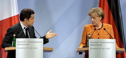 Merkel and Sarkozy resolve dispute over car emissions