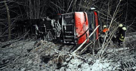 Double-decker bus flips on icy road