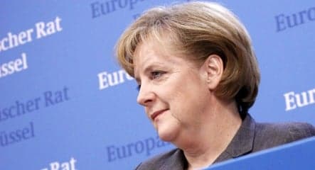 Merkel says 'Oui' to EU stimulus, climate deals