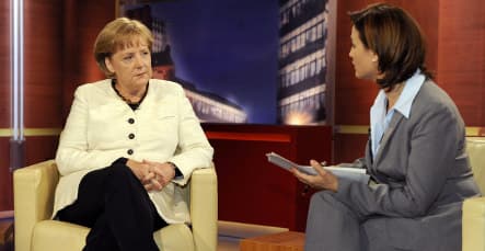 Merkel defends her East German past