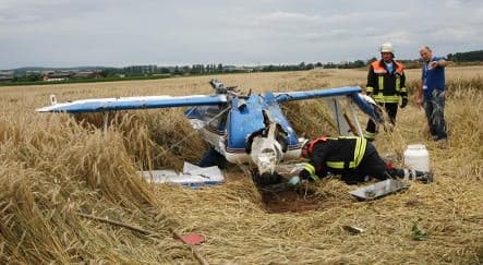 Looping plane collides with family in car