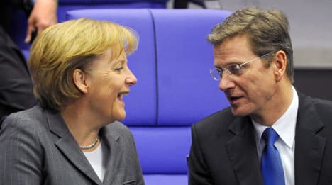 Merkel backs coalition between CDU and FDP