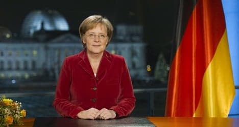 Merkel warns of bumpy economy in 2010