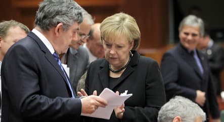 Merkel defies Europe over bank-bonus tax