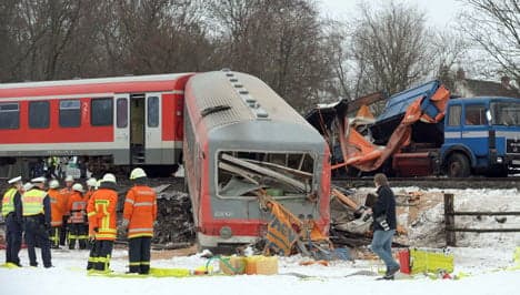 Twelve injured in train collision with truck