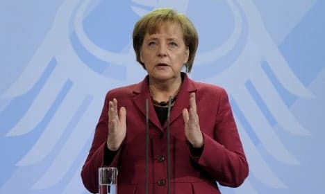 Merkel warns Iran of coming sanctions