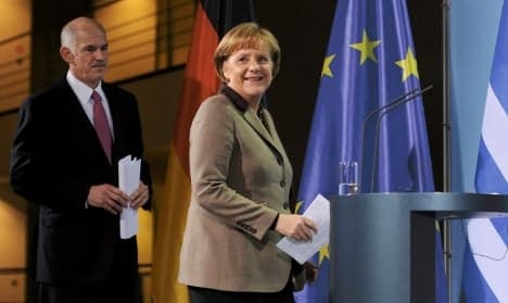 Merkel pledges eurozone stability to Greece