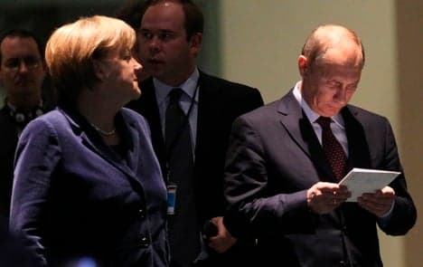 Putin backtracks on trade zone after Merkel's cool response