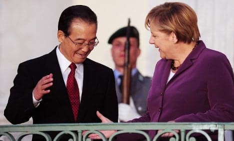 China promises Merkel help with debt crisis