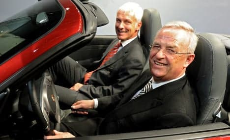 Porsche merger with VW delayed