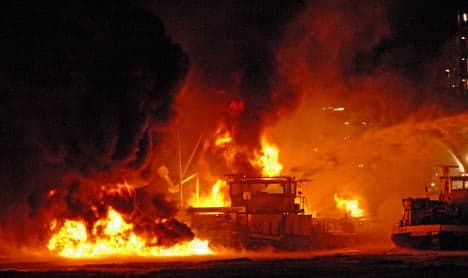 Tanker sinks after explosions at refinery