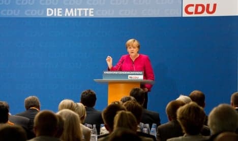 Merkel repeats call for bank aid in debt crisis