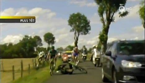 TV car upends Tour de France cyclists