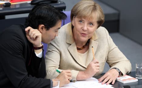 Merkel's coalition holds, passes euro bailout