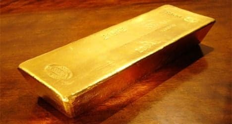 Gold's status boosted as Swiss weaken franc