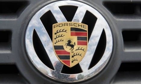 Volkswagen and Porsche delay merger