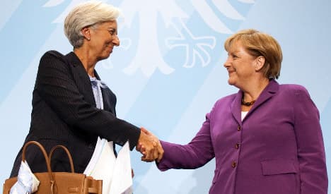 IMF boss throws down gauntlet to Merkel