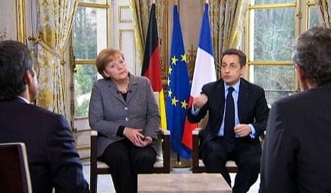 Merkel backs Sarkozy in tough re-election battle