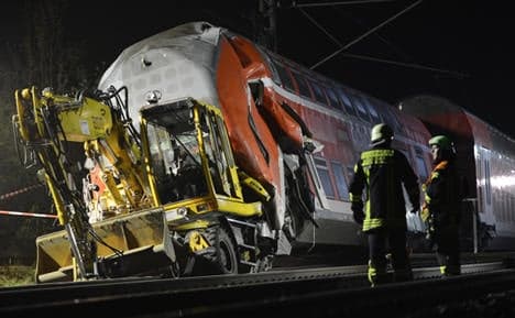 Train hits digger, kills three, injures 13