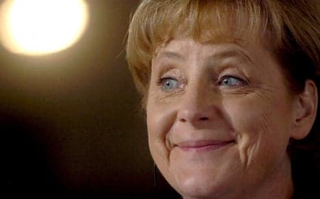 Merkel's conservatives hit four-year poll high