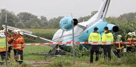 Private jet nearly hits bus after missing runway