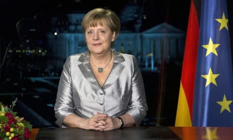 Merkel warns of tougher times ahead