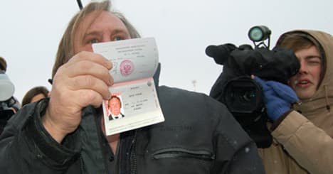 Depardieu shows off new Russian passport