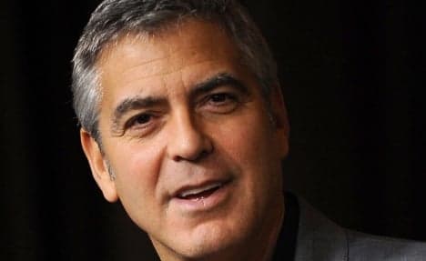 Clooney baffles Berliner by paying dinner bill