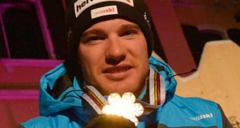 Cologna wins historic first Nordic world ski title