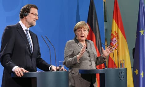 Merkel praises Spanish PM for economic reforms