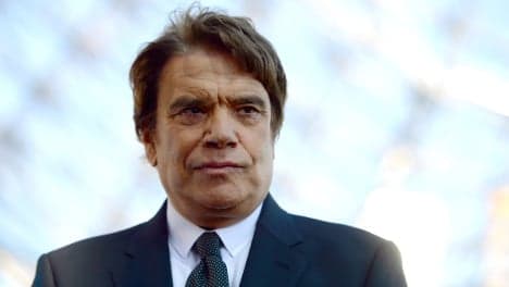 French tycoon Tapie charged with corruption