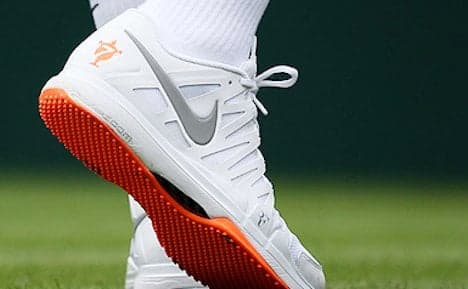 Wimbledon sees red over Federer's orange shoes