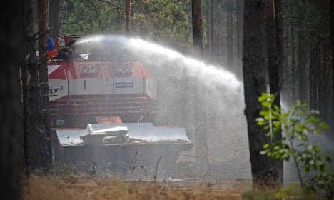 Firemen fight explosive forest inferno
