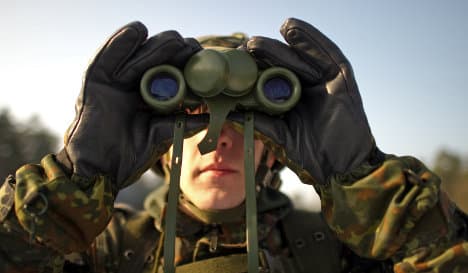 Merkel denies US spying 'old news' to army