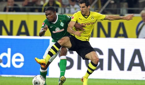 Dortmund down Bremen to stay top of Bundesliga