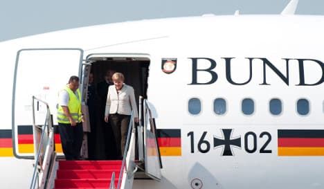 The man who gate-crashed Merkel's plane