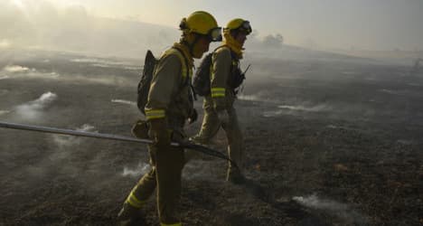 Firefighters battle wild blazes across Spain
