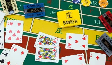 Gambling banker 'took €8.4m from customers'