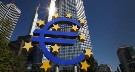 EU praises Spain's banks but wary over debt risk