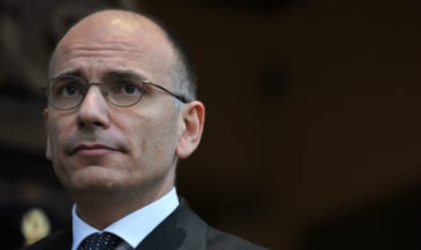 Italy 'vulnerable' without lower loan costs: PM