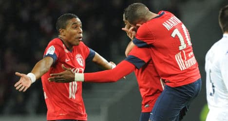 Lille win to stay in touch with PSG at top