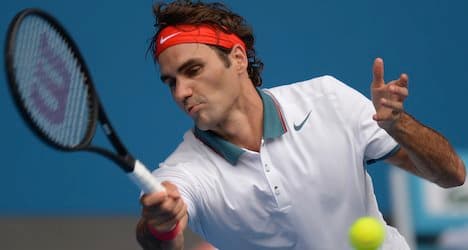 Federer eases into fourth round Down Under