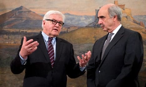Germany pledges aid to Greece, urges reform
