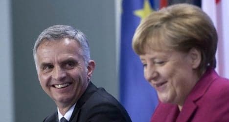 Germany's Merkel comes to Switzerland's defence