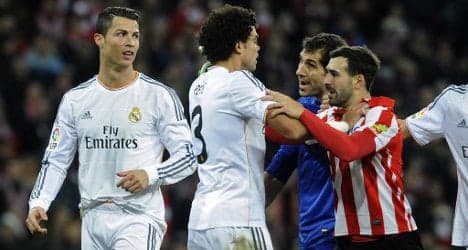 Atleti go top as Ronaldo's red holds Real back