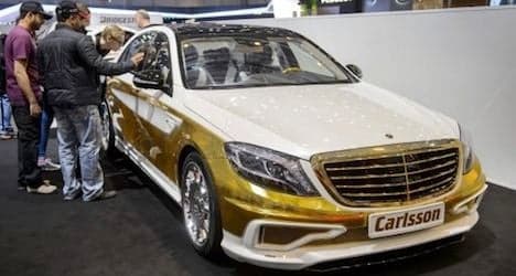 Gold-plated car shines at Geneva motor show