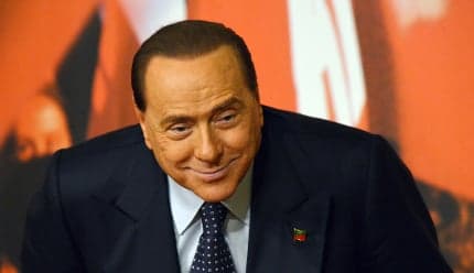 Berlusconi is 'pleased' to be helping the needy