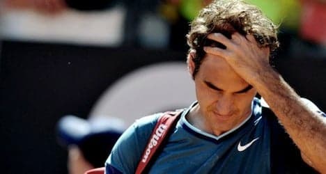 Federer suffers upset loss in windswept Rome