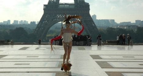 Paris: Coq-walking artist guilty of exhibitionism